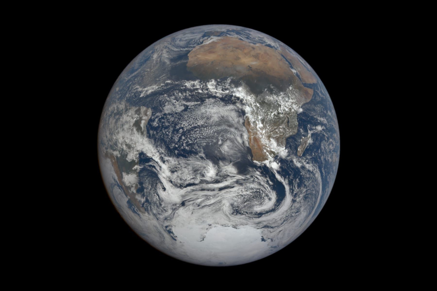 Full disc of Earth seen from space, with Africa at the top and bright Antarctic ice at the bottom